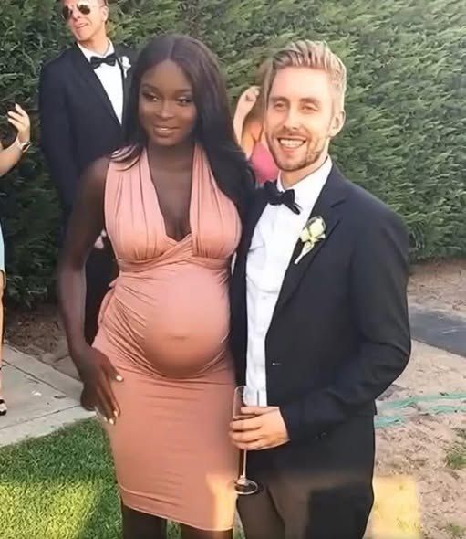 HT1. The dark-skinned model got married to a blue-eyed blonde. Now look what they look like.