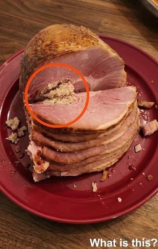 HT1. I went to the store and bought some ham. When I got home and started slićing it, I saw this.