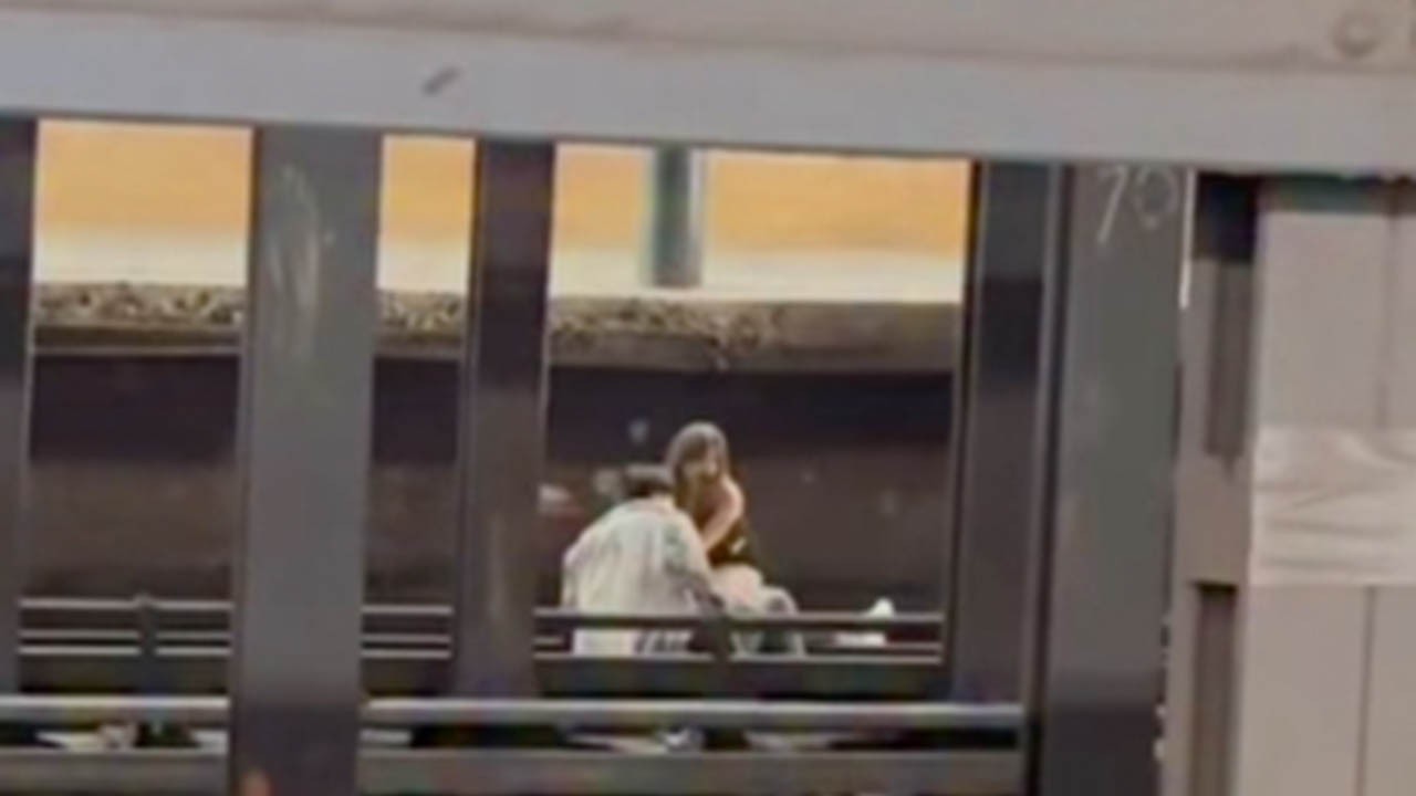 HT4. Footage shows what man and woman did moments before a train fatally struck them