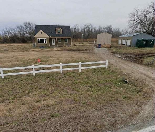 HT3. Incredible Real Estate Opportunity: 4-Bedroom Home with Acreage and Detached Garage in Augusta, Kansas